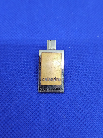 Pin’s Calandre Paco Rabanne parfum vintage années 90 publicitaire0