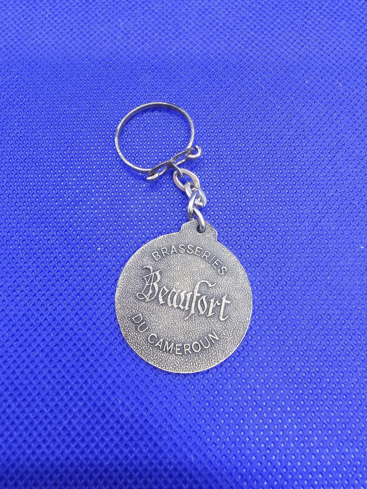 Porte‑clés vintage Brasseries Beaufort du Cameroun – métal ancien1